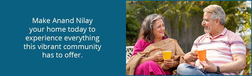 a 55+ Indian couple drinking tea outside their home in Tampa, Florida