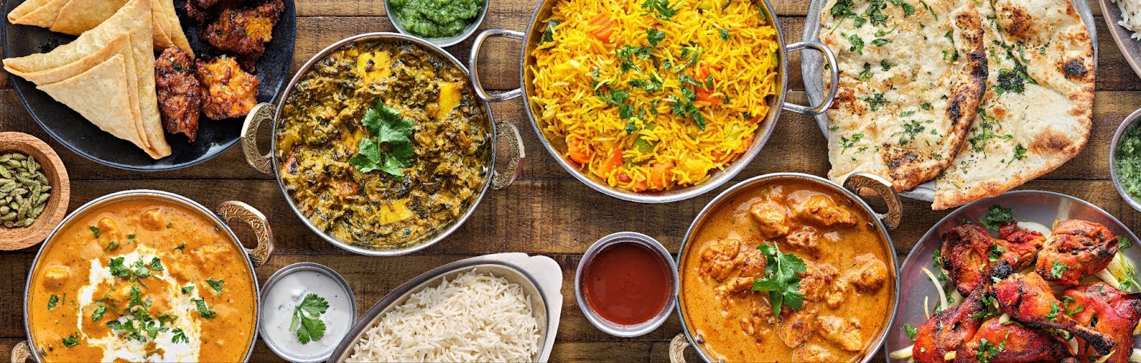 a table with different kinds of indian food in tampa fl